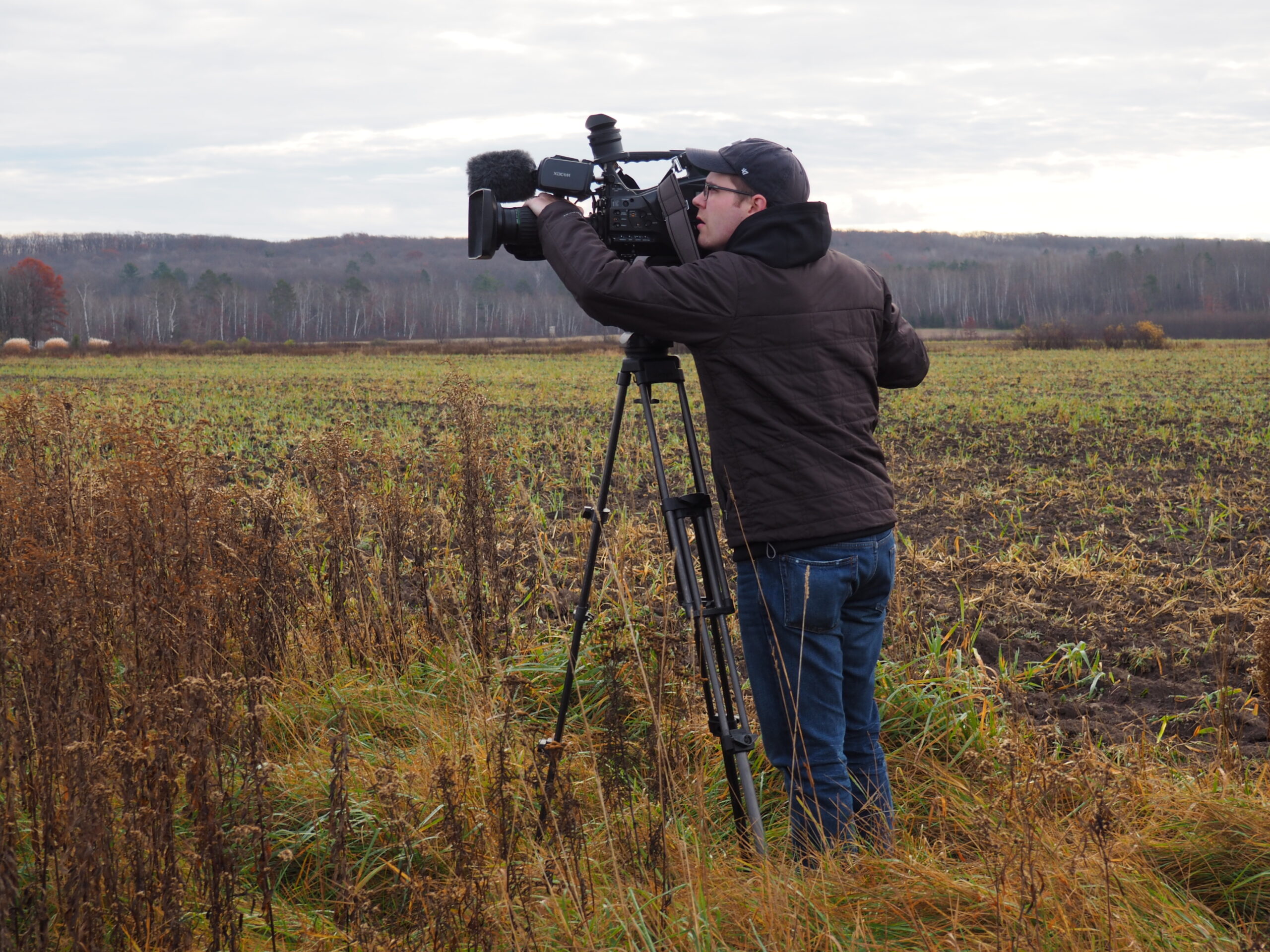 Person behind the camera recording video for a PBS Wisconsin project.